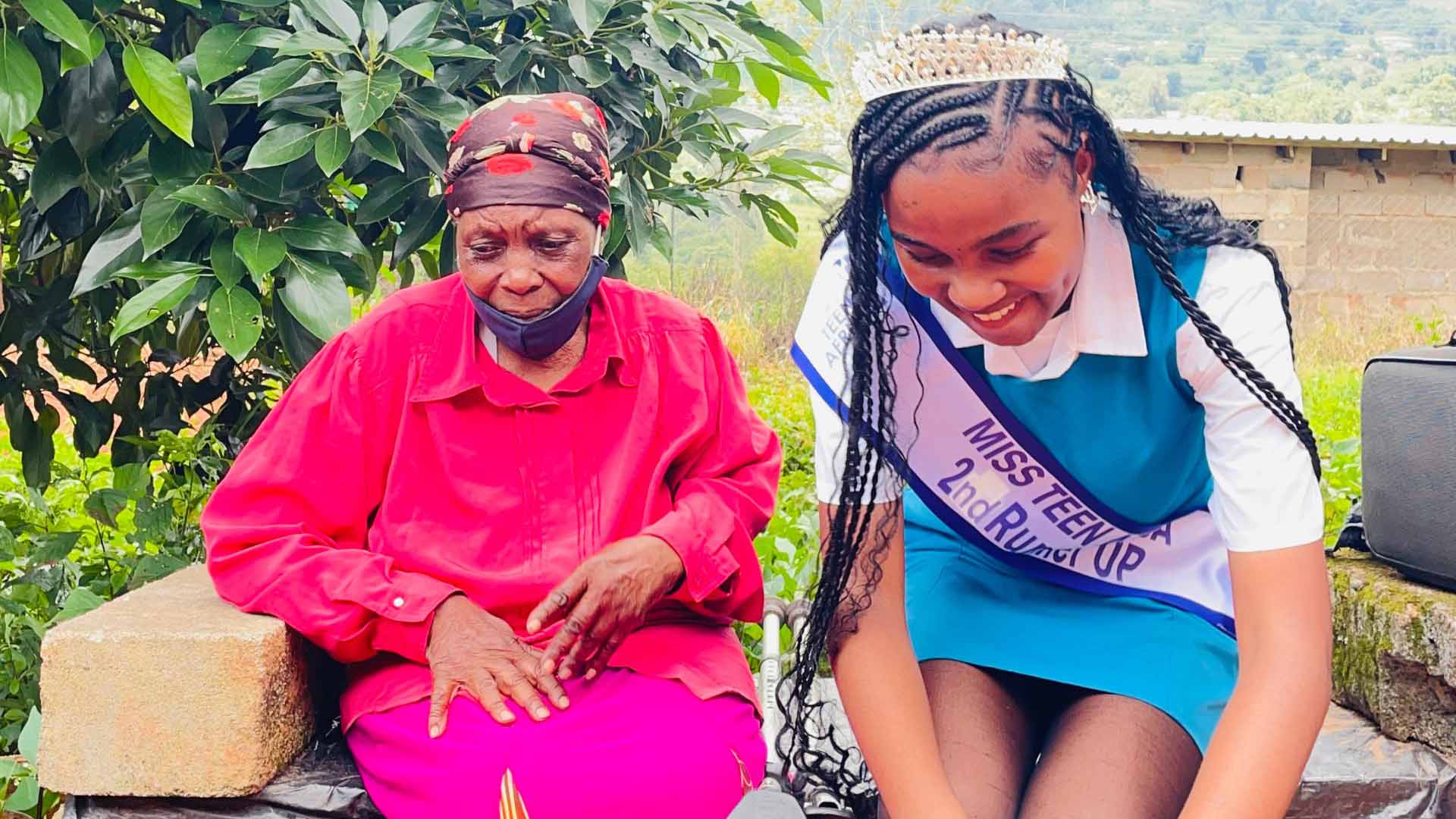 The young beauty queen with Gogo Kunene after the service.